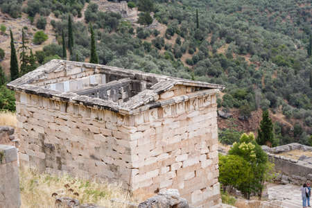 The Treasury of the Athenians on the Hillside of the Archaeological Site of Delphi, Greeceの写真素材