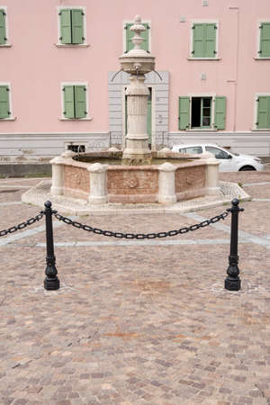 old fountain in the center of Levico Terme , a village in the Italian Alpsの写真素材