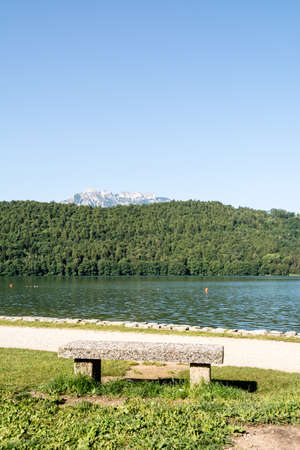 stone bench at Levico Lake ,Dolomiti, Italyの写真素材