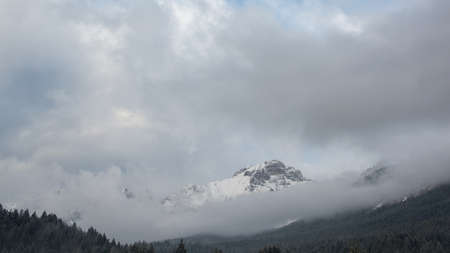 snow storm over Paganella Mountain in Adamello-Brenta National Park, Dolomites, Italyの写真素材