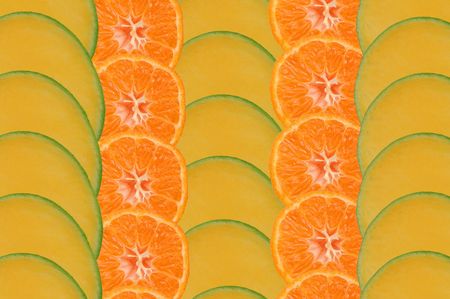Composition made of slices of mango and tangerineの写真素材