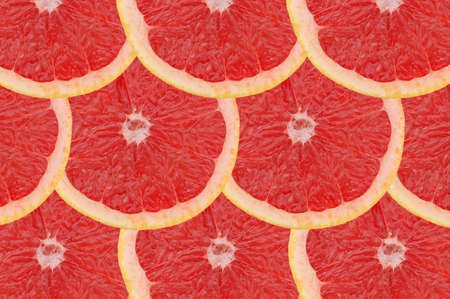 Composition made of slices of red grapefruitsの写真素材