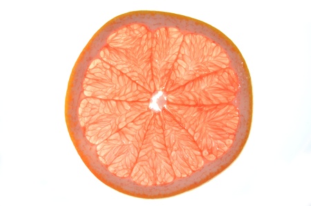 slice of red grapefruit isolated on white backgroundの写真素材