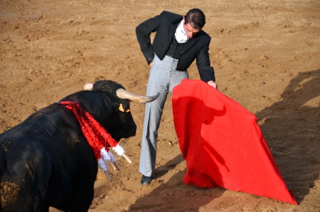 Fontanar, Spain  August 19, 2012 : Toreador fighting with bull during corrida show.のeditorial素材