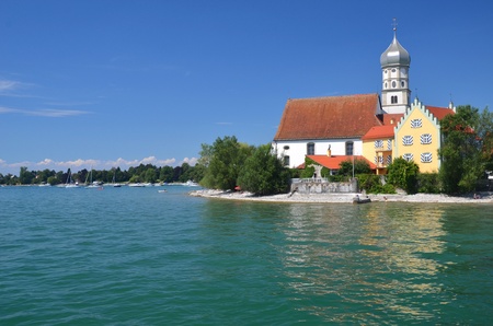 Picturesque view on church in Wasserburg on Lake Bodensee, Germanyの写真素材