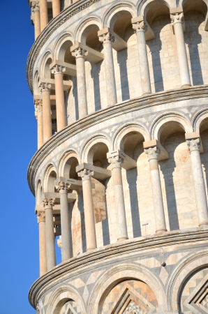 Closeup of famous Leaning Tower on Square of Miracles in Pisa, Tuscany - Italyの写真素材