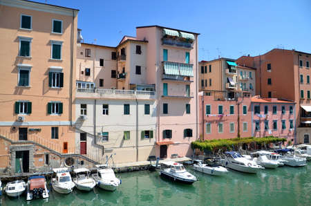 Picturesque view on boats in city channel in Livorno, Italyのeditorial素材