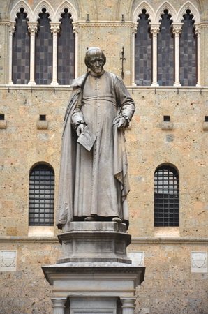 The monument of Sallustio Bandini on Square Salimbeni in Siena, Tuscany in Italyの写真素材