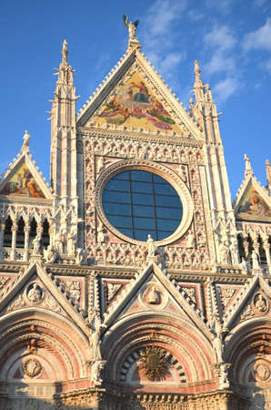 FaÃ§ade of magnificent marble cathedral in Siena, Italyの写真素材
