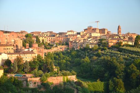 Gorgeous panorama of Siena at sunset, Tuscany, Italyの写真素材