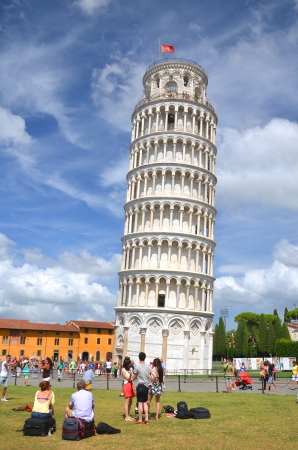 Tourists watching  on Square of Miracles visiting Leaning Tower in Pisa, Italyのeditorial素材