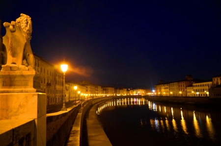 Moody night scene of Arno river in Pisa, Tuscany, Italyの写真素材