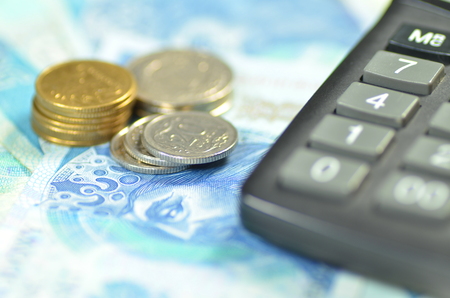 zloty banknotes and coins from Poland and calculatorの写真素材