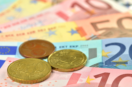variety of euro banknotes and coinsの写真素材