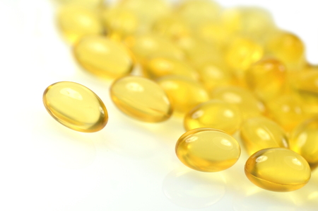 fish oil capsules isolated on white backgroundの写真素材
