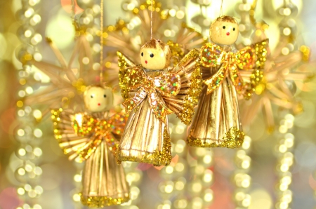 christmas decoration, angel made of straw and bokeh backgroundの写真素材