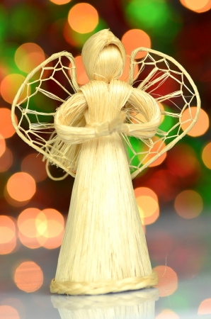 christmas decoration, angel made of straw and bokeh backgroundの写真素材