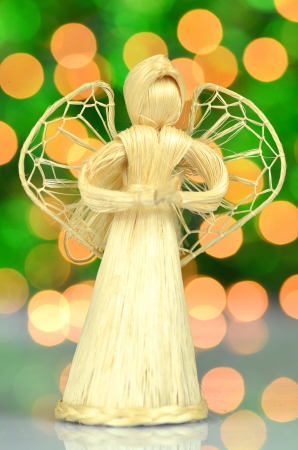 christmas decoration, angel made of straw and bokeh backgroundの写真素材