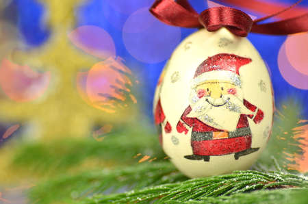 Christmas bauble  made by decoupage technique on bokeh backgroundの写真素材