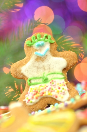 Delicious decorated Christmas cookies on bokeh backgroundの写真素材