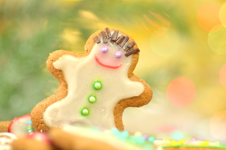 Delicious decorated Christmas cookies on bokeh backgroundの写真素材