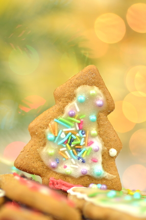 Delicious decorated Christmas cookies on bokeh backgroundの写真素材