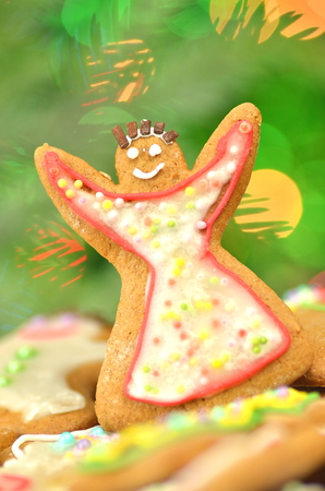 Delicious decorated Christmas cookies on bokeh backgroundの写真素材