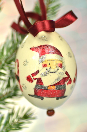 Christmas bauble  made by decoupage technique on bokeh backgroundの写真素材