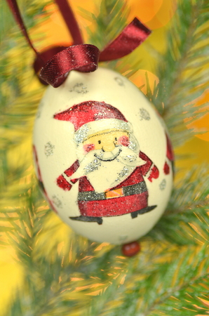 Christmas bauble  made by decoupage technique on bokeh backgroundの写真素材