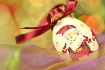 Christmas bauble  made by decoupage technique on bokeh backgroundの写真素材
