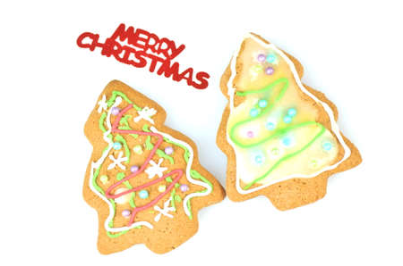 Delicious decorated Christmas cookies isolated on white backgroundの写真素材