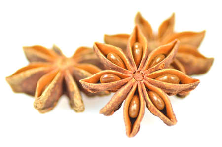 christmas spices, anise stars isolated on white background の写真素材