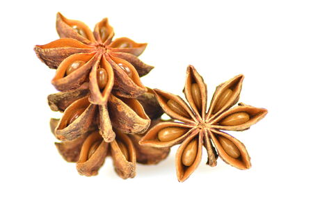 christmas spices, anise stars isolated on white background の写真素材