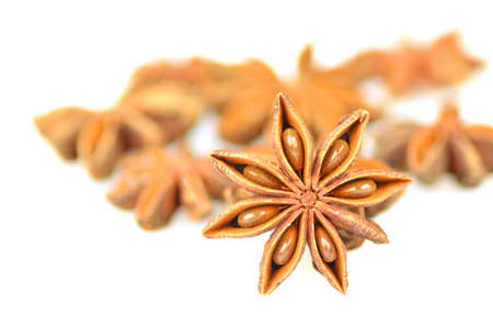 christmas spices, anise stars isolated on white background の写真素材