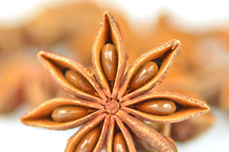 christmas spices, anise stars isolated on white background の写真素材