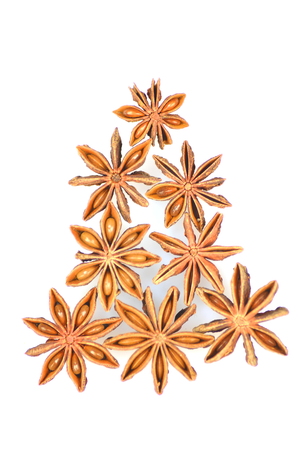 christmas spices, anise stars isolated on white background の写真素材