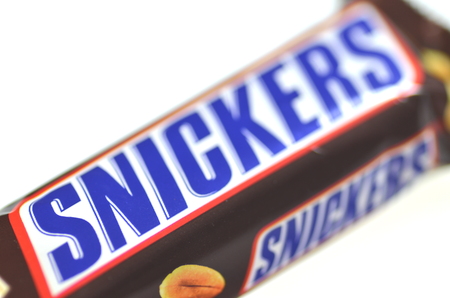 Snickers chocolate bar isolated on white backgroundのeditorial素材