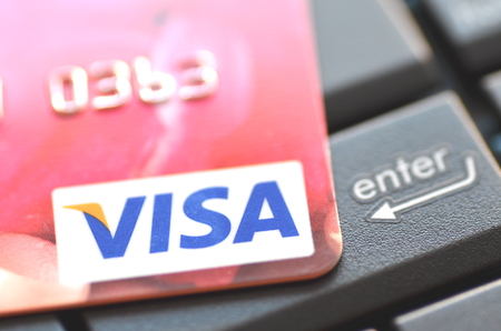 Closeup of VISA credit card on laptop keyboardのeditorial素材