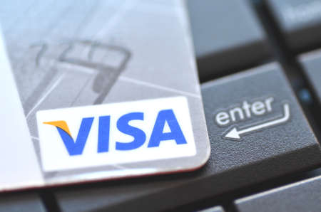 Closeup of VISA credit card on laptop keyboardのeditorial素材