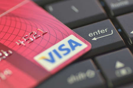 Closeup of VISA credit card on laptop keyboard