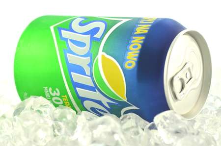 Sprite drink in a can on ice isolated on white backgroundのeditorial素材