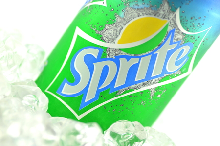 Sprite drink in a can on ice isolated on white backgroundのeditorial素材
