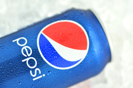 Pepsi drink in a can on ice isolated on white background