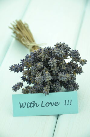with love wishes and bouquet of delicate dry lavender flowers の写真素材