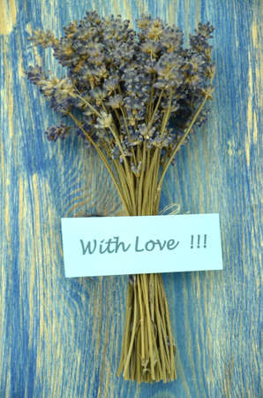 with love wishes and bouquet of delicate dry lavender flowers の写真素材