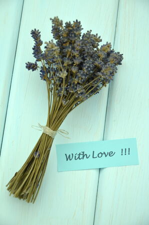 with love wishes and bouquet of delicate dry lavender flowers の写真素材