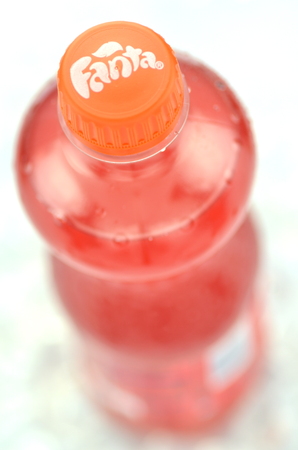 Bottle of Fanta drink on ice cubesのeditorial素材