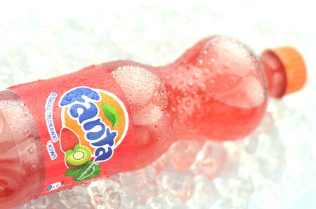 Bottle of Fanta drink on ice cubesのeditorial素材
