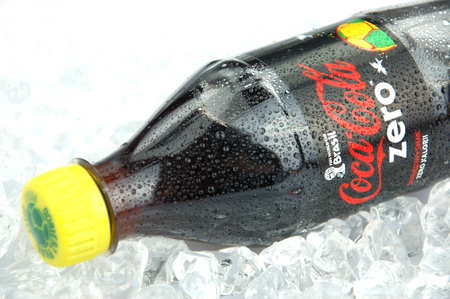 Bottle of Coca-Cola Zero drink on ice cubesのeditorial素材