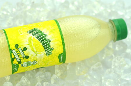 Bottle of Mirinda drink on ice cubesのeditorial素材